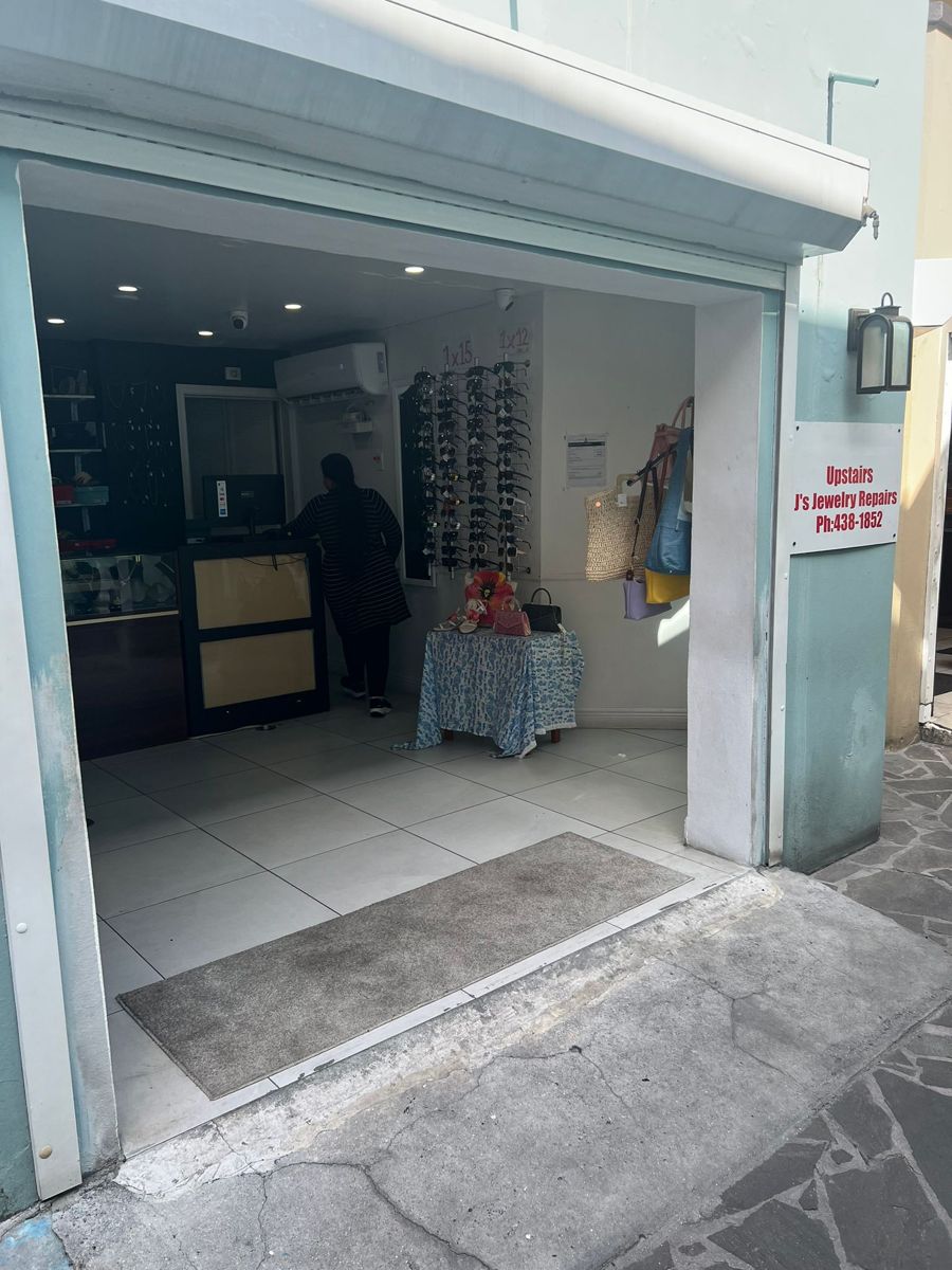 Inside the Sapphire shop: jewelry cases, a wall of sunglasses and leather bags